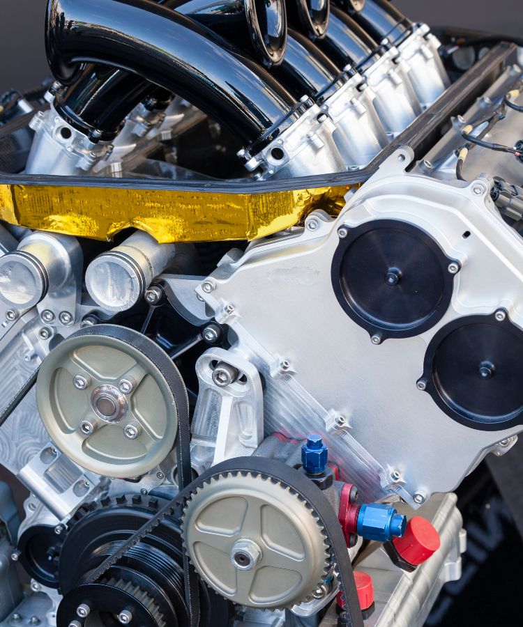 The inside of a very clean racing car engine.